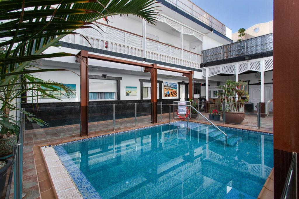 a swimming pool in front of a building at Casa Paula - 24 in Arinaga