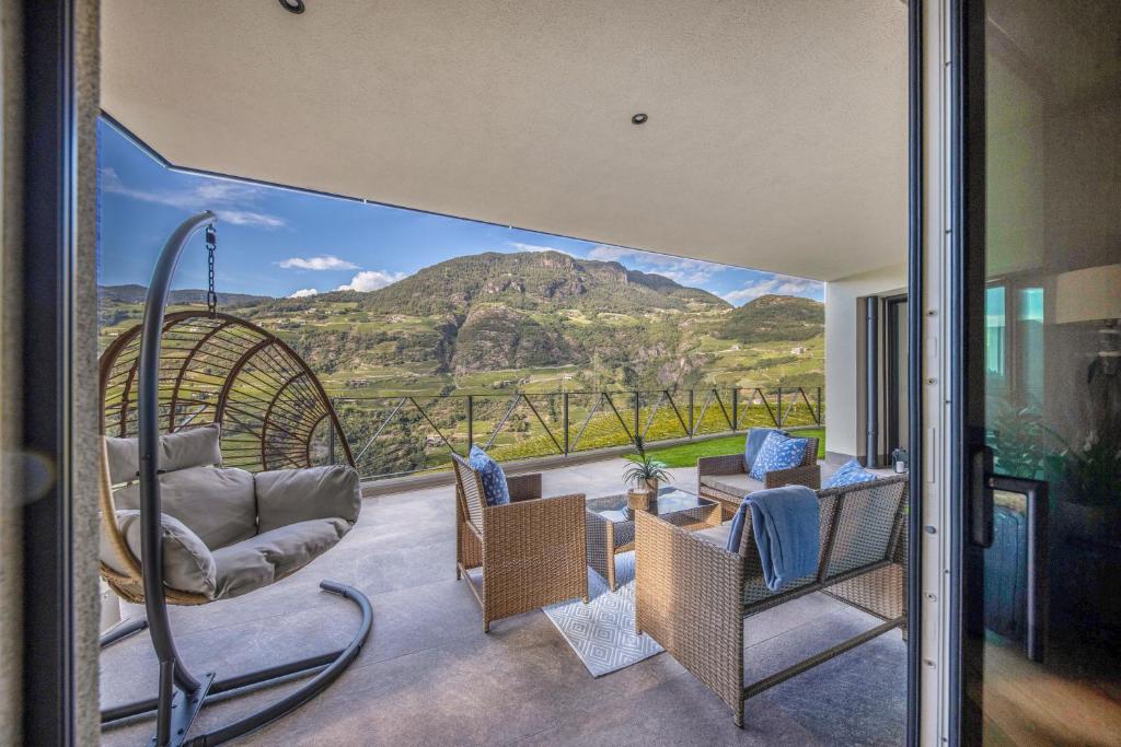 a living room with a view of a mountain at Apartment 16 cityview in Cornedo all'Isarco