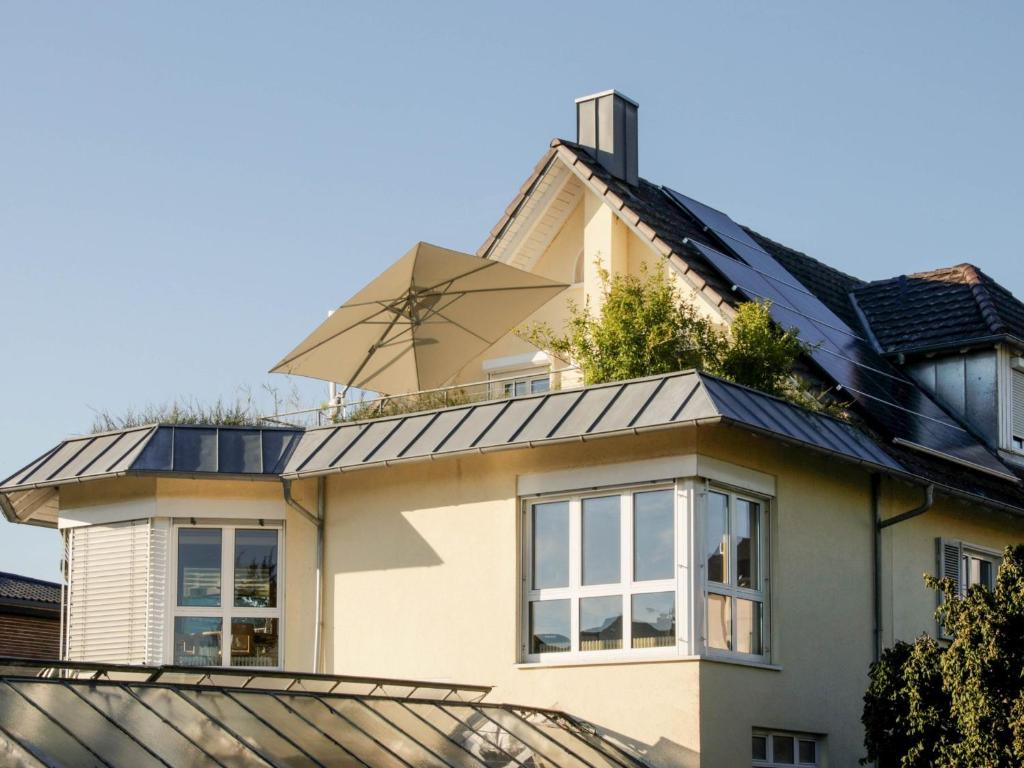 a house with a windmill on top of it at Über der alten Gärtnerei in Allensbach