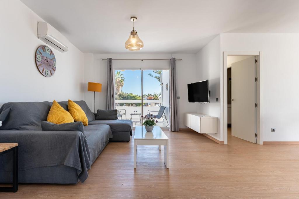 a living room with a couch and a table at Apartment Mijas Sun and Beach in Sitio de Calahonda