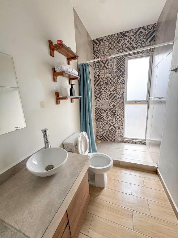 a bathroom with a sink and a toilet at Casa Sto Domingo terraza PB 3KM del centro in Oaxaca City