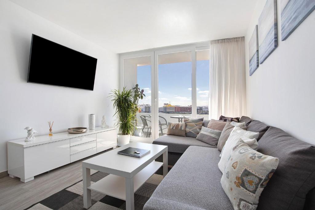 a living room with a couch and a table at Casa Helieta in Puerto del Rosario