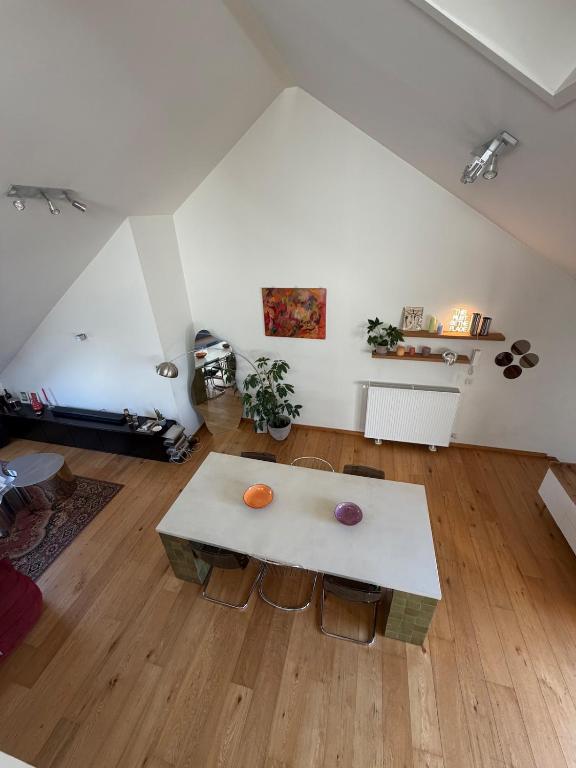 a living room with a white table and chairs at Cosy Studio in Mechelen by Studio Pila in Mechelen