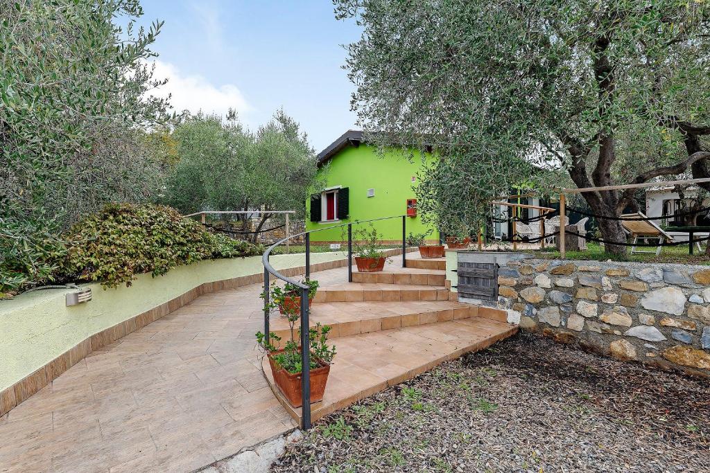 a set of stairs leading to a green house at Agriturismo Green House in Santo Stefano al Mare
