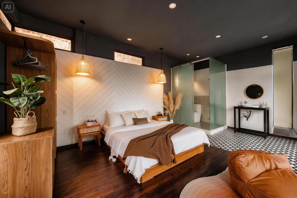 a bedroom with a large bed and a glass wall at BeYouth Hotel Dalat Valley View in Da Lat