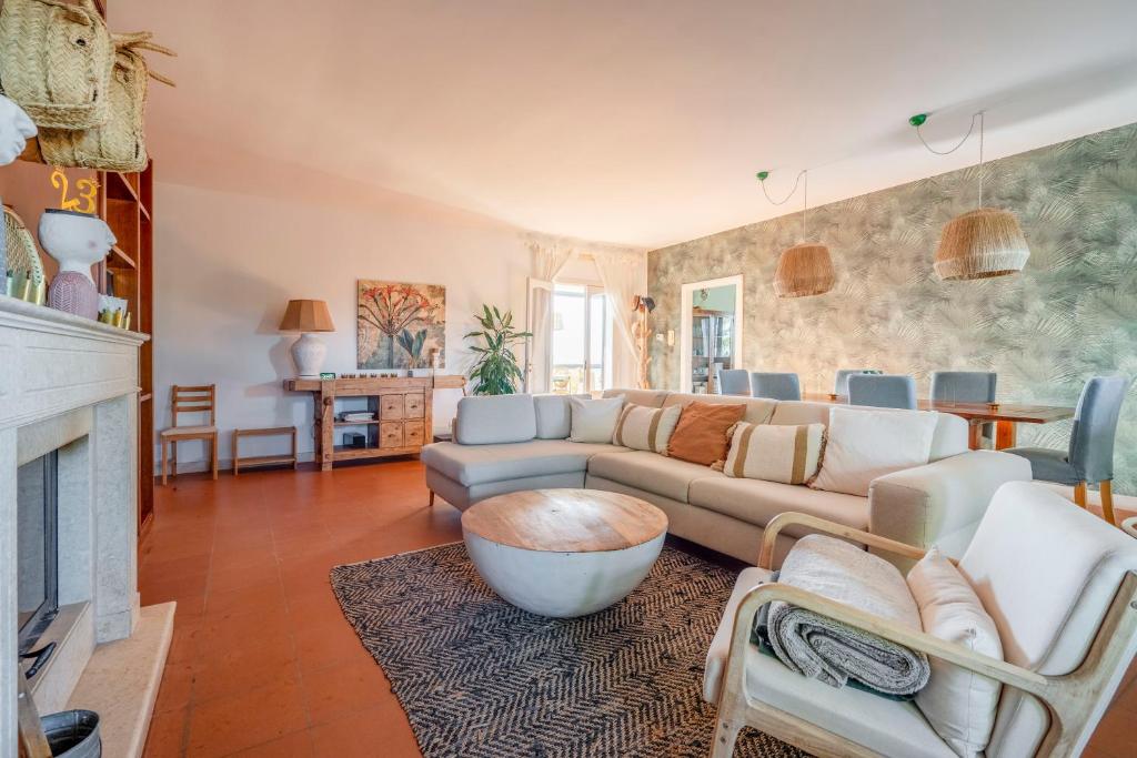 a living room with a couch and a fireplace at House in Villa Torto in Monopoli