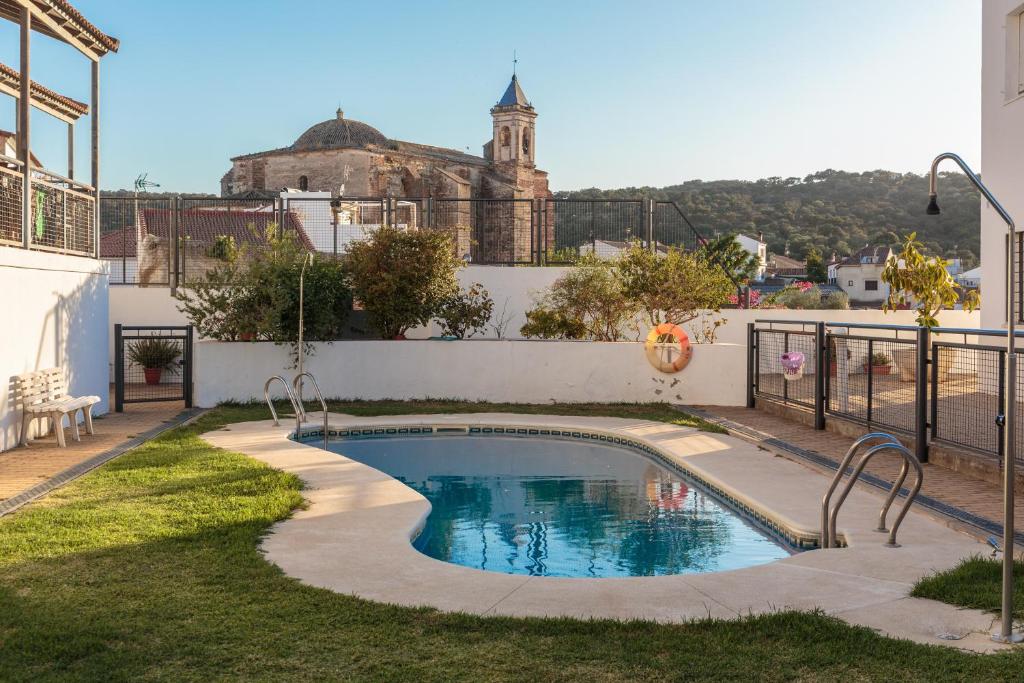 a small swimming pool in the yard of a house at El Balcón de la Sierra in Seville