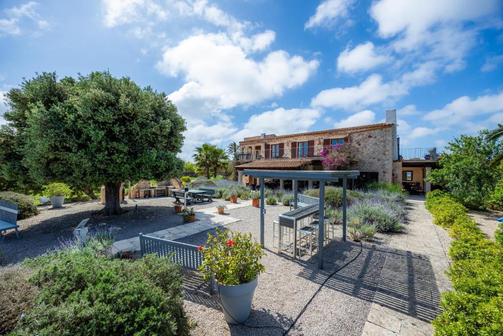 a view of a garden with a building at Siesta del Sol in Manacor