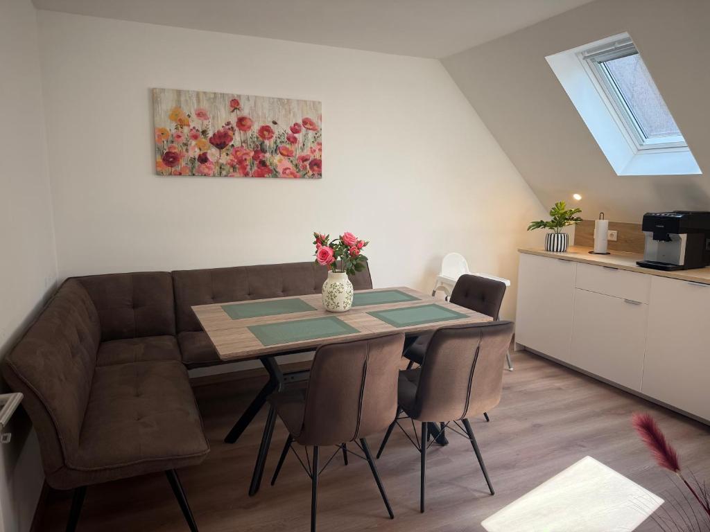 a living room with a table and a couch at Ferienquartier alte Bäckerei in Feldberg