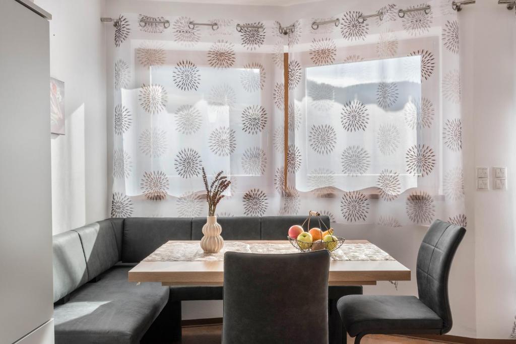 a dining room with a table and chairs at Trojer Apartment 1 in Sarntal