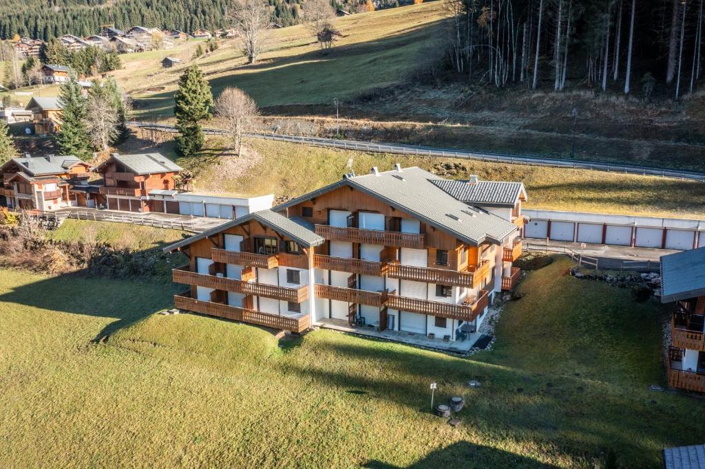an aerial view of a large house in a field at Studio Rez-de-jardin, 4 pers Chatel in Châtel