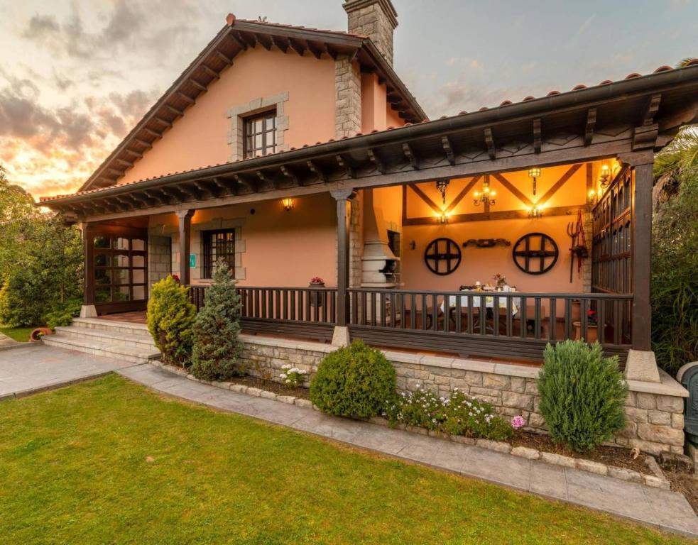 a house with a porch with lights on it at Casa Grau in Llanes
