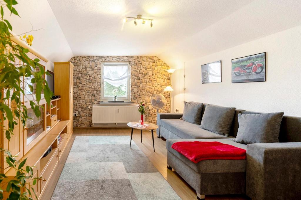 a living room with a couch and a table at Picco 1 in Beuren