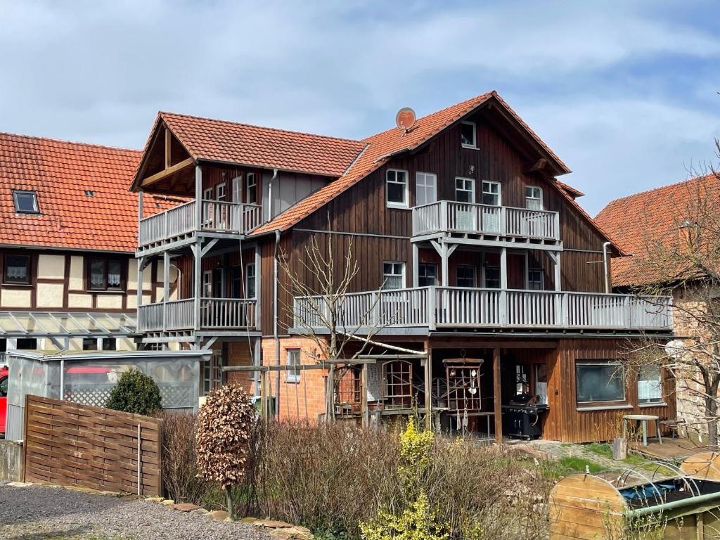 a large wooden house with balconies on it at Ferienhaus Hof Schäfer in Waldeck