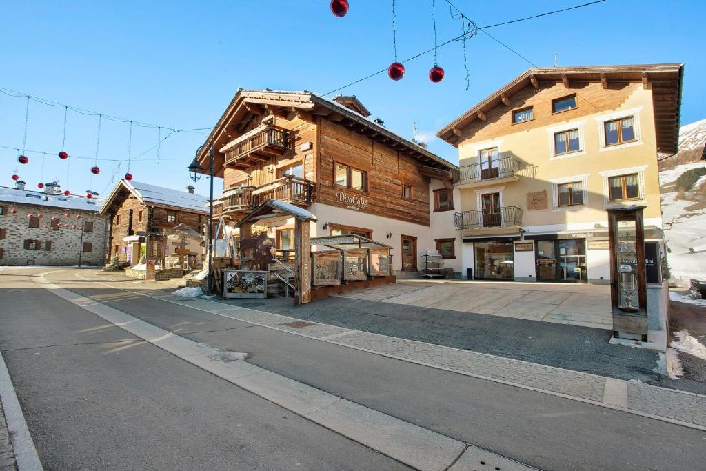 an empty street in a town with buildings at Lovin Summer in Livigno