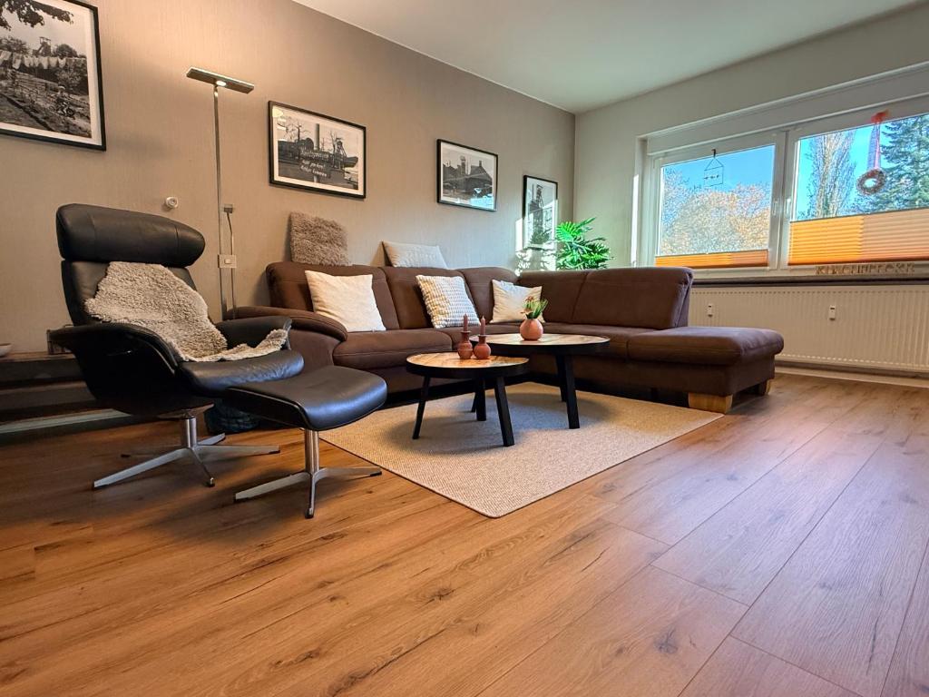 a living room with a couch and a table at Ferienwohnung Glückauf in Castrop-Rauxel