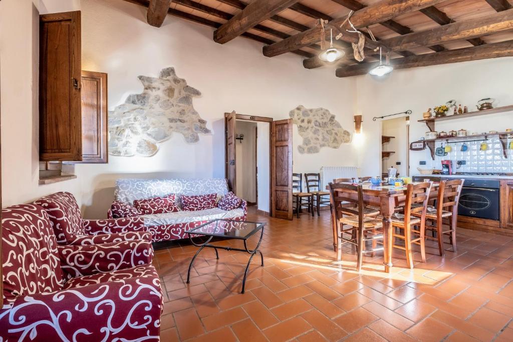 a living room with a couch and a table at Genziana in Arcidosso