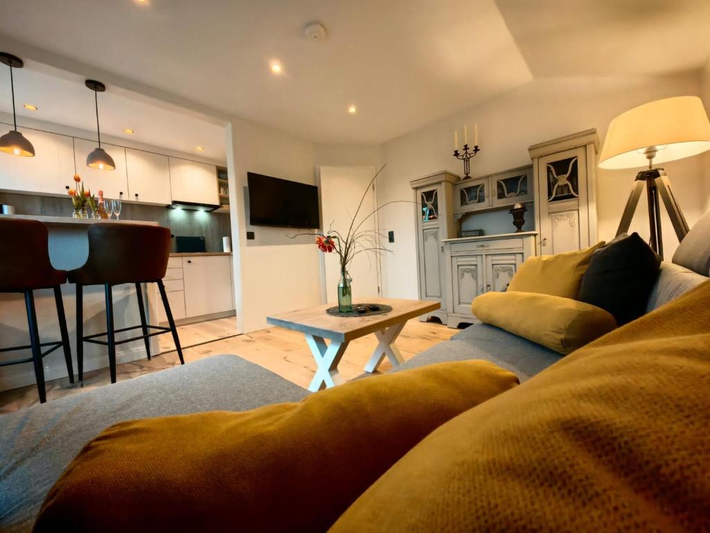 a living room with a couch and a table at nord-ostseeglück in Ladelund