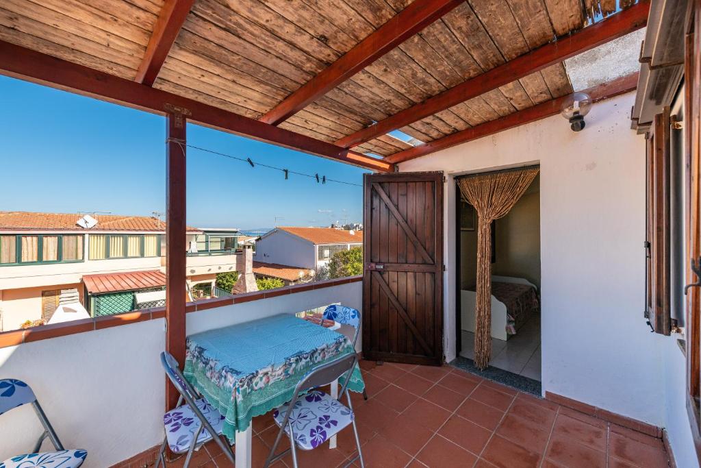 a balcony with a view of a bedroom at Via Mazzini 87 in Calasetta