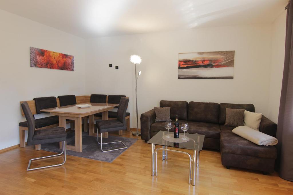 a living room with a couch and a table at Ferienwohnung Oberpfälzer Wald in Vohenstrauß