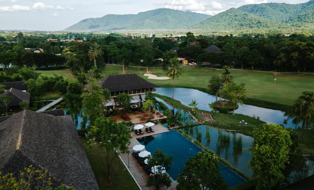 an aerial view of a resort with a swimming pool at Kirimaya Golf Resort Spa - SHA Plus Certified in Mu Si