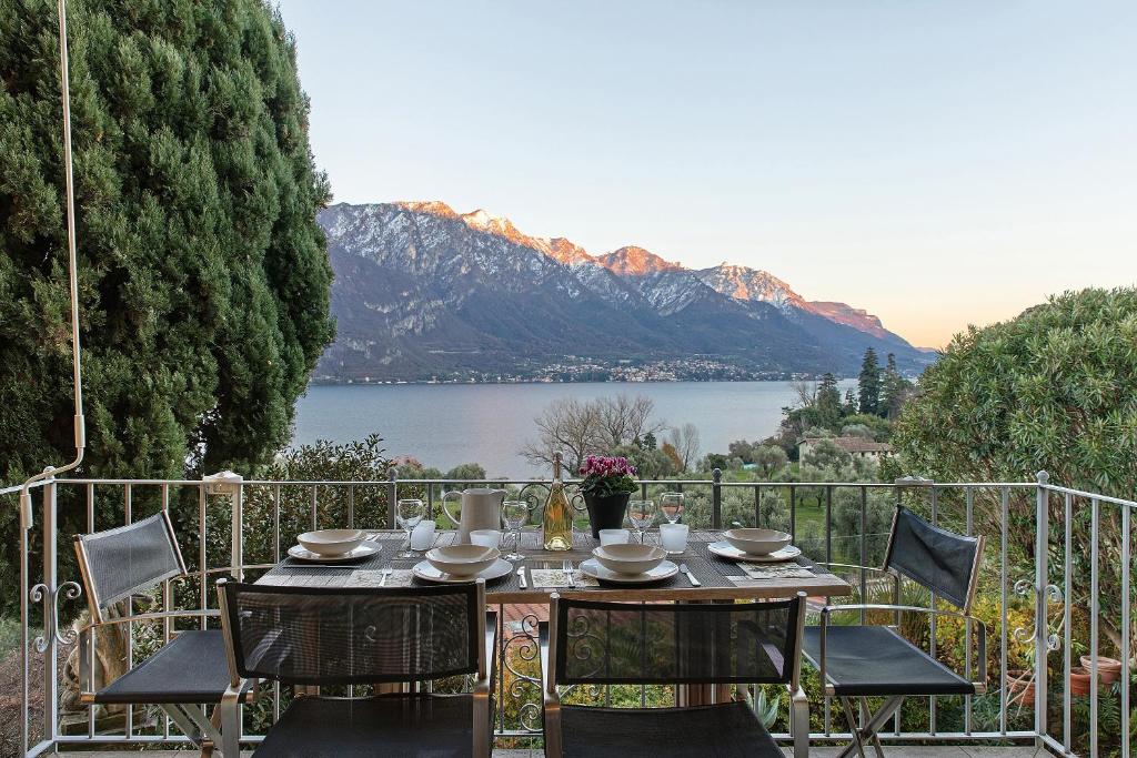 a table and chairs with a view of a lake at Charming Lake View Bellagio in Bellagio