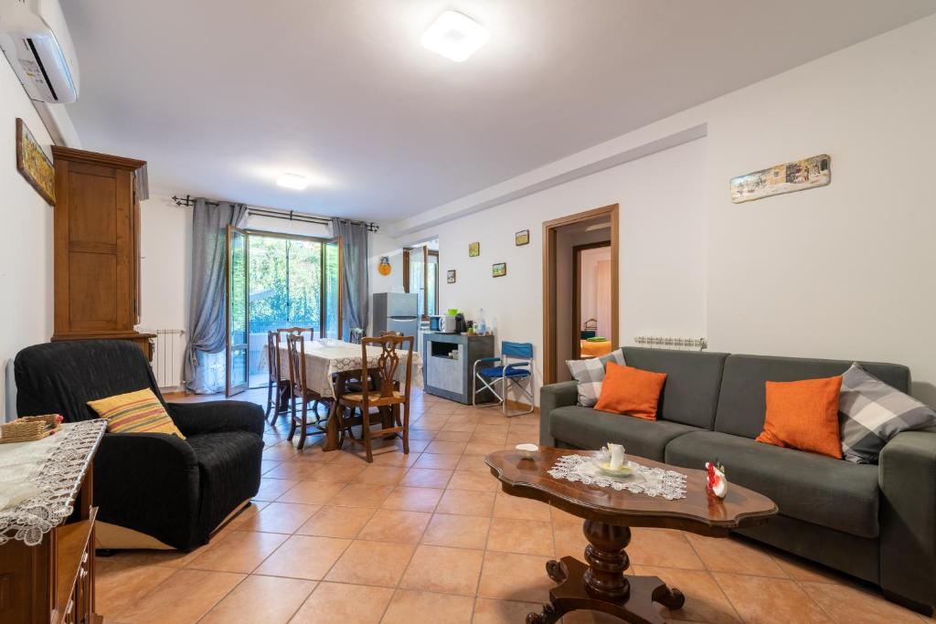 a living room with a couch and a table at Casaentino in Capolona