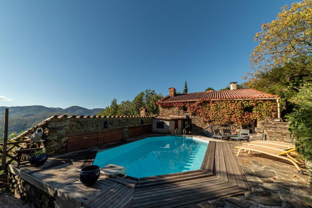 a swimming pool in a yard with a house at Villa Casablanca in Montferrer