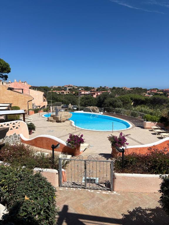 a view of two swimming pools in a resort at C 210 Puntavilla in La Maddalena