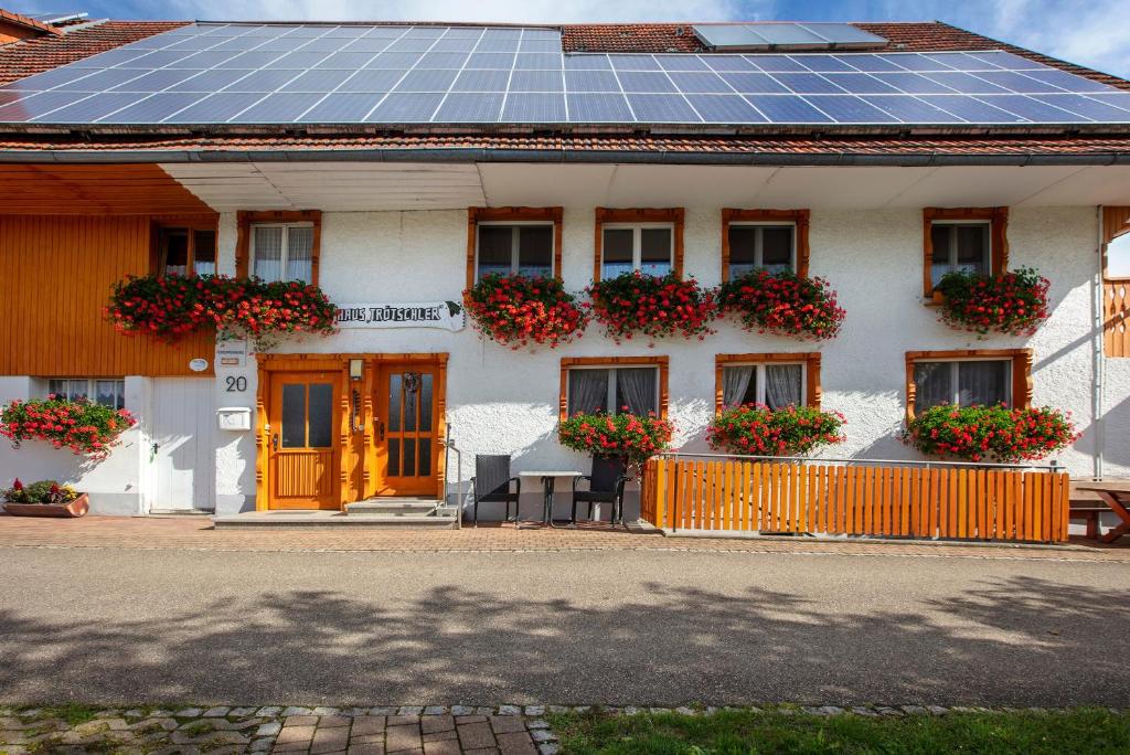 a house with a lot of windows with a solar roof at Haus Trötschler in Weilheim