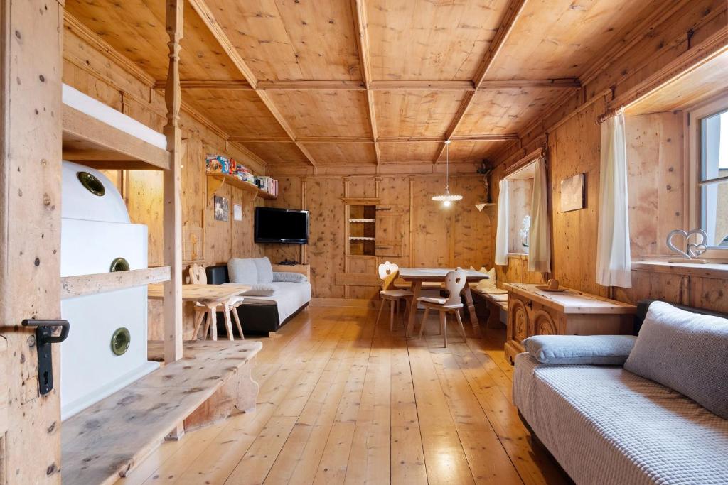 a living room with a couch and a table at Bertollhof Apfelerlebnis in Silandro