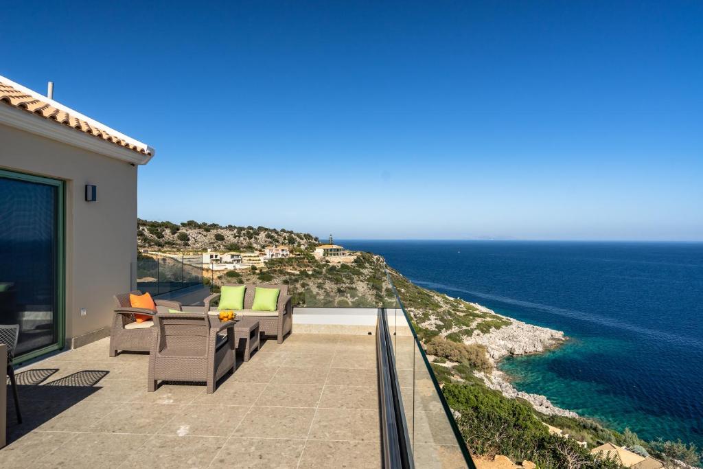 a balcony with a view of the ocean at Joy Horizon in Skala