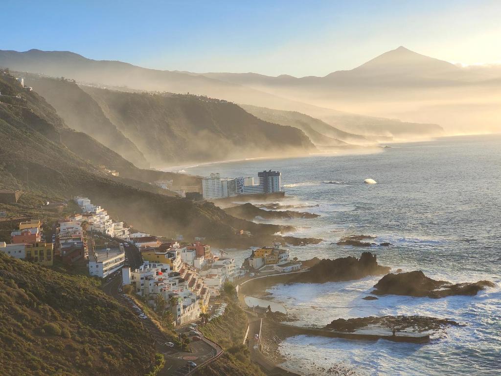 an aerial view of a beach with buildings and the ocean at Olas del Atlántico in Tacoronte