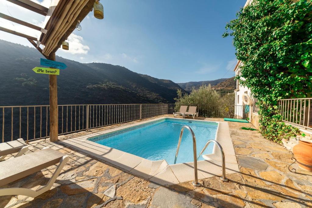 a swimming pool with a view of a mountain at C´antonia Y Manuel in Laroya
