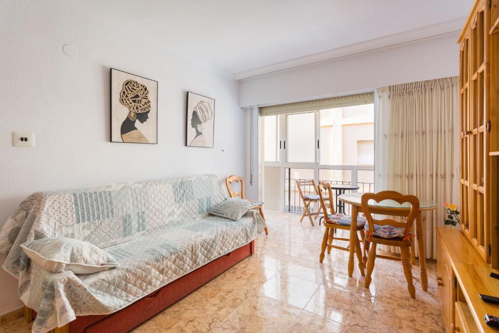 a living room with a couch and a table at Bonanza in Gandía