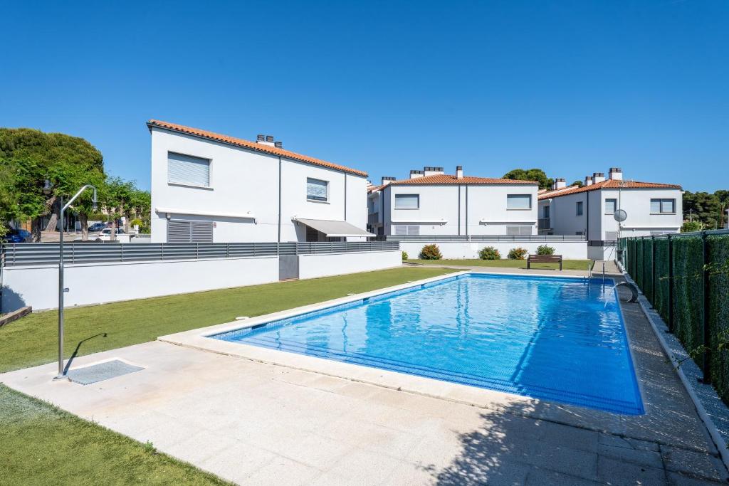 a swimming pool in the backyard of a house at Casa Roc De Sant Gaietà in Roda de Bará