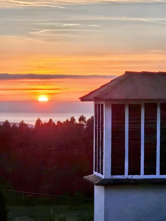 a sunset from the roof of a building at Casa Corral Bouzamayor in Valdoviño
