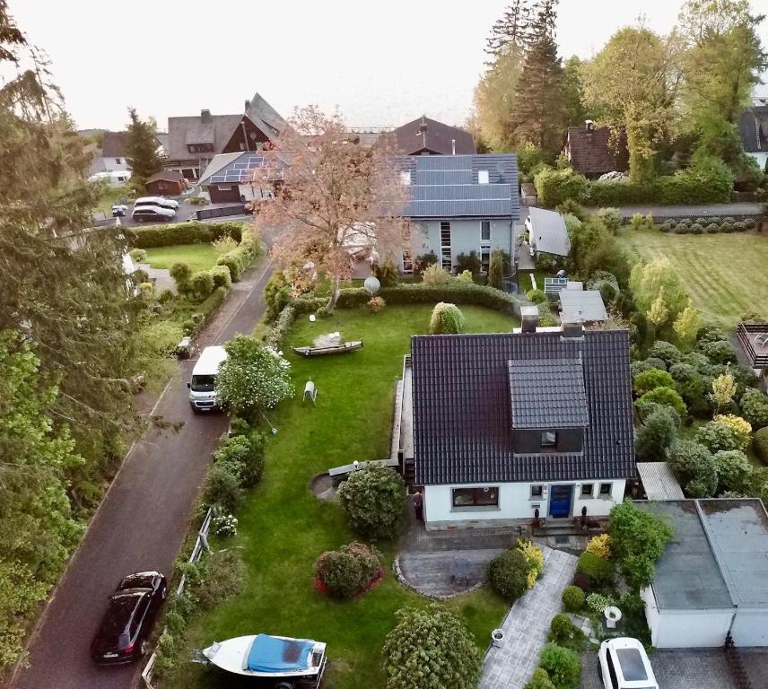 an aerial view of a house with a solar roof at Ferienhaus Dell in Möhnesee