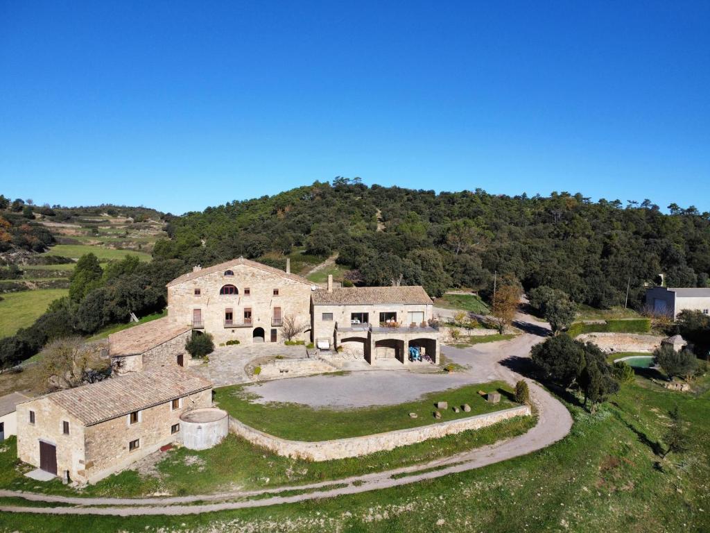 an aerial view of a house on a hill at Les Corts De Biosca in Castelltallat