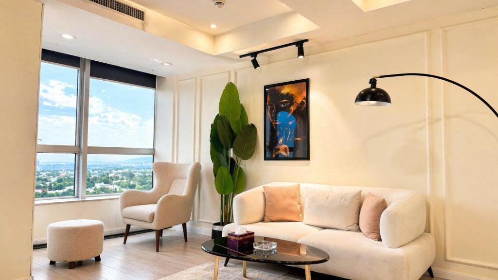 a living room with a couch and a table at 1 Bedroom Apartment at Centaurus Mall in Islamabad