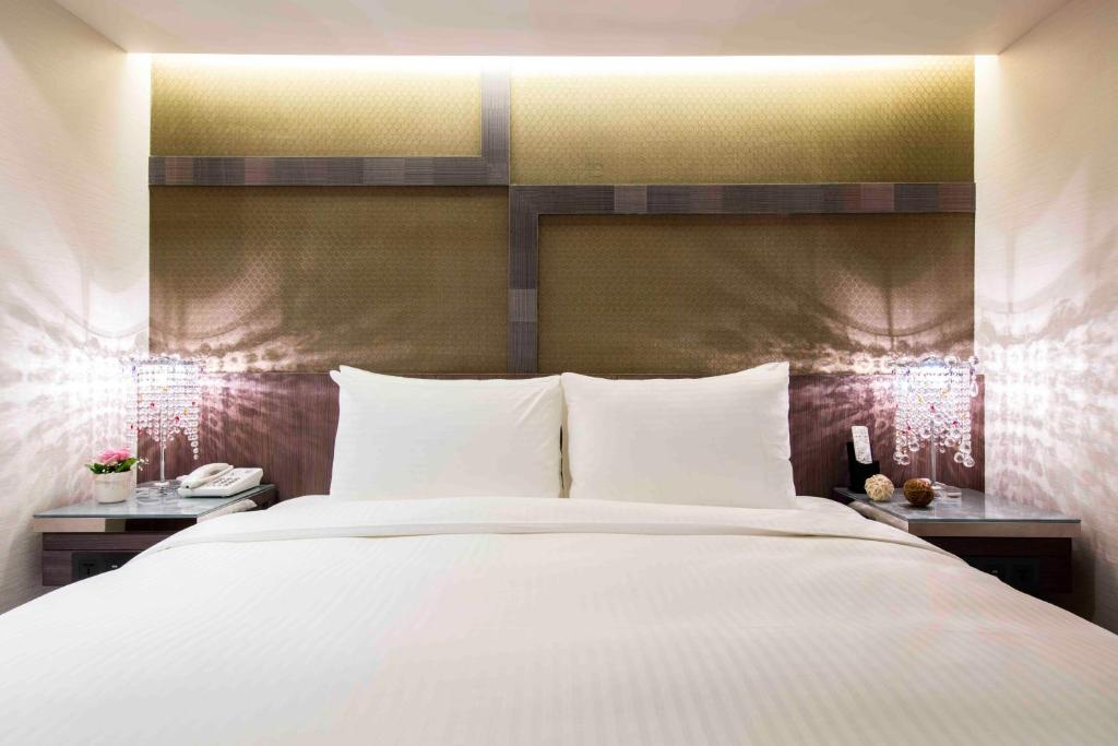 Postel nebo postele na pokoji v ubytování Hotel I Journey