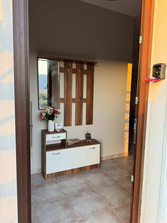 a bathroom with a sink and a mirror in a room at Val's place in Mytilene