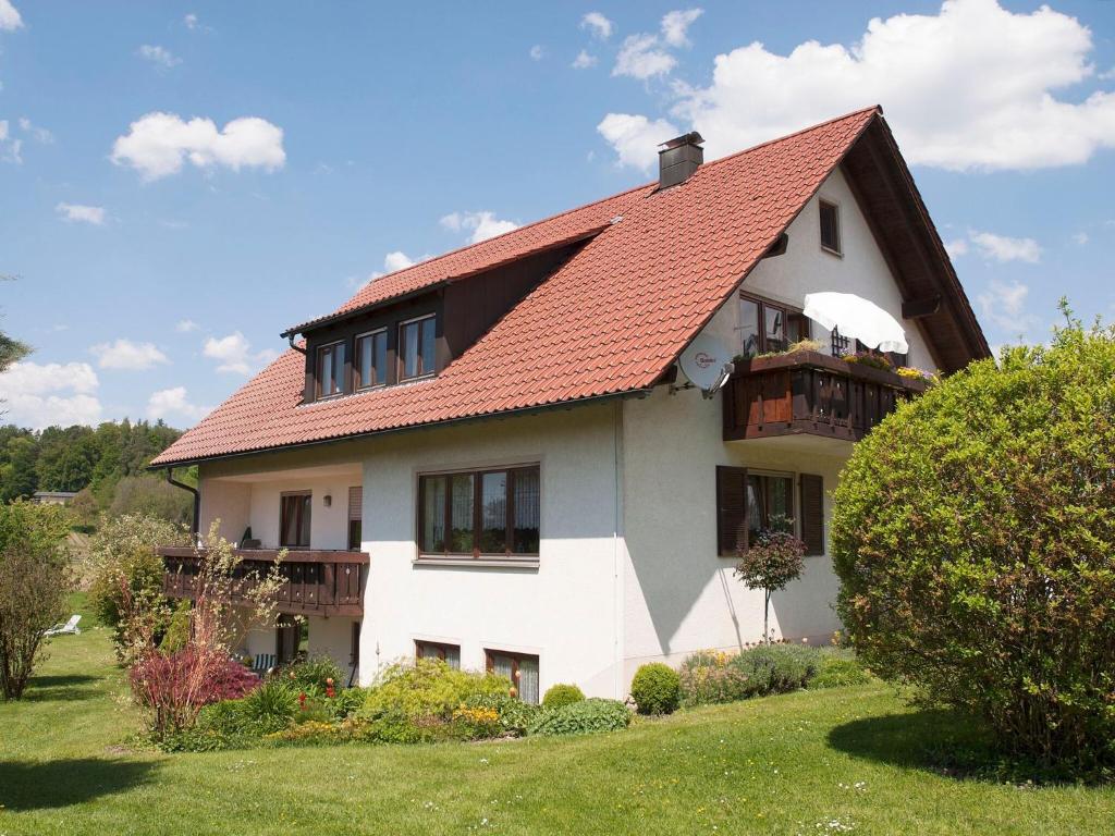 a large white house with a red roof at Apfelhof Maurer in Lindau