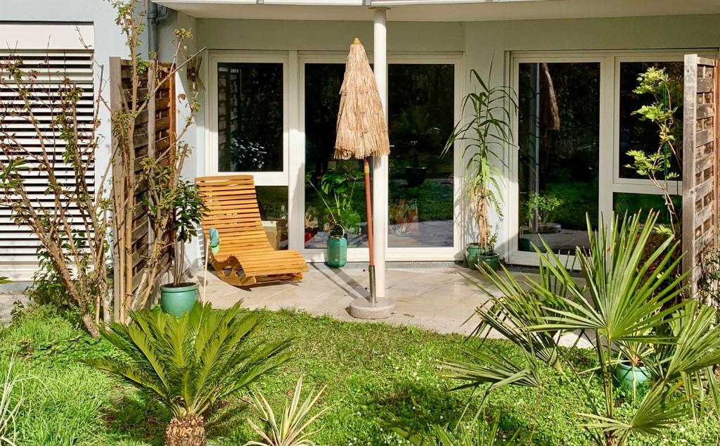 a patio with a chair on a house at Hotz in Radolfzell am Bodensee