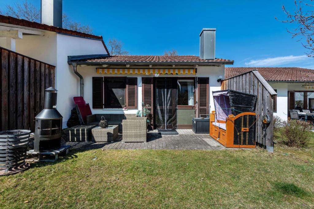 a house with a front porch with a grill at all u need 4 holiday - fewo44 in Mühlthal