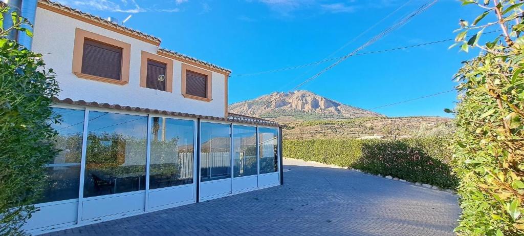 a building with a view of a mountain in the background at Casa Pedro in Vélez-Rubio