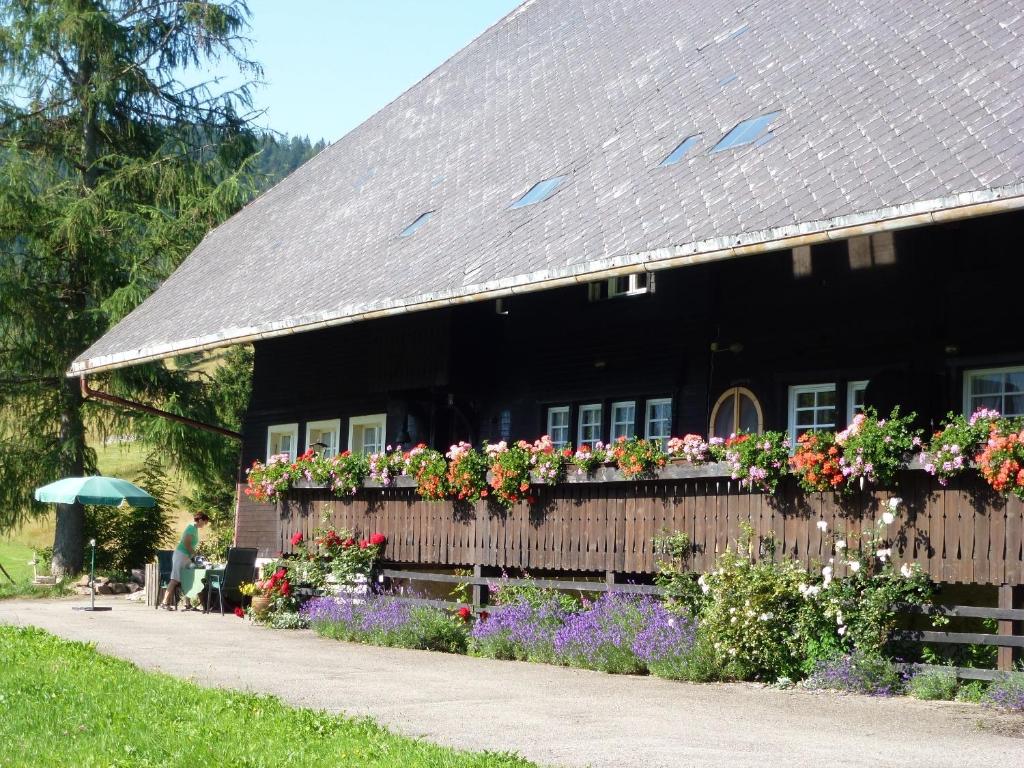 a house with flowers on the side of it at Kammbühlhof in St. Blasien
