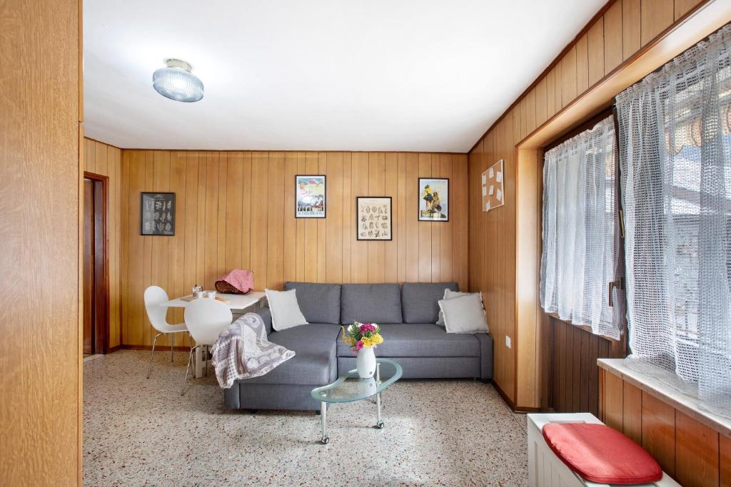 a living room with a couch and a table at da Lule in Aosta