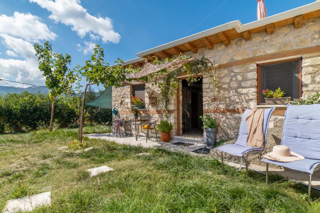 a cottage with a view of the garden at Villa Lazar in Lefkada