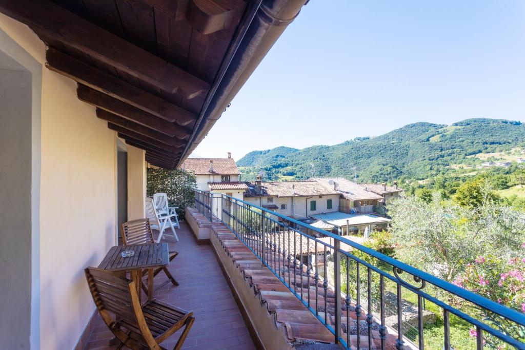 a balcony of a house with two benches on it at Casa Rita app 1 in Tremosine Sul Garda